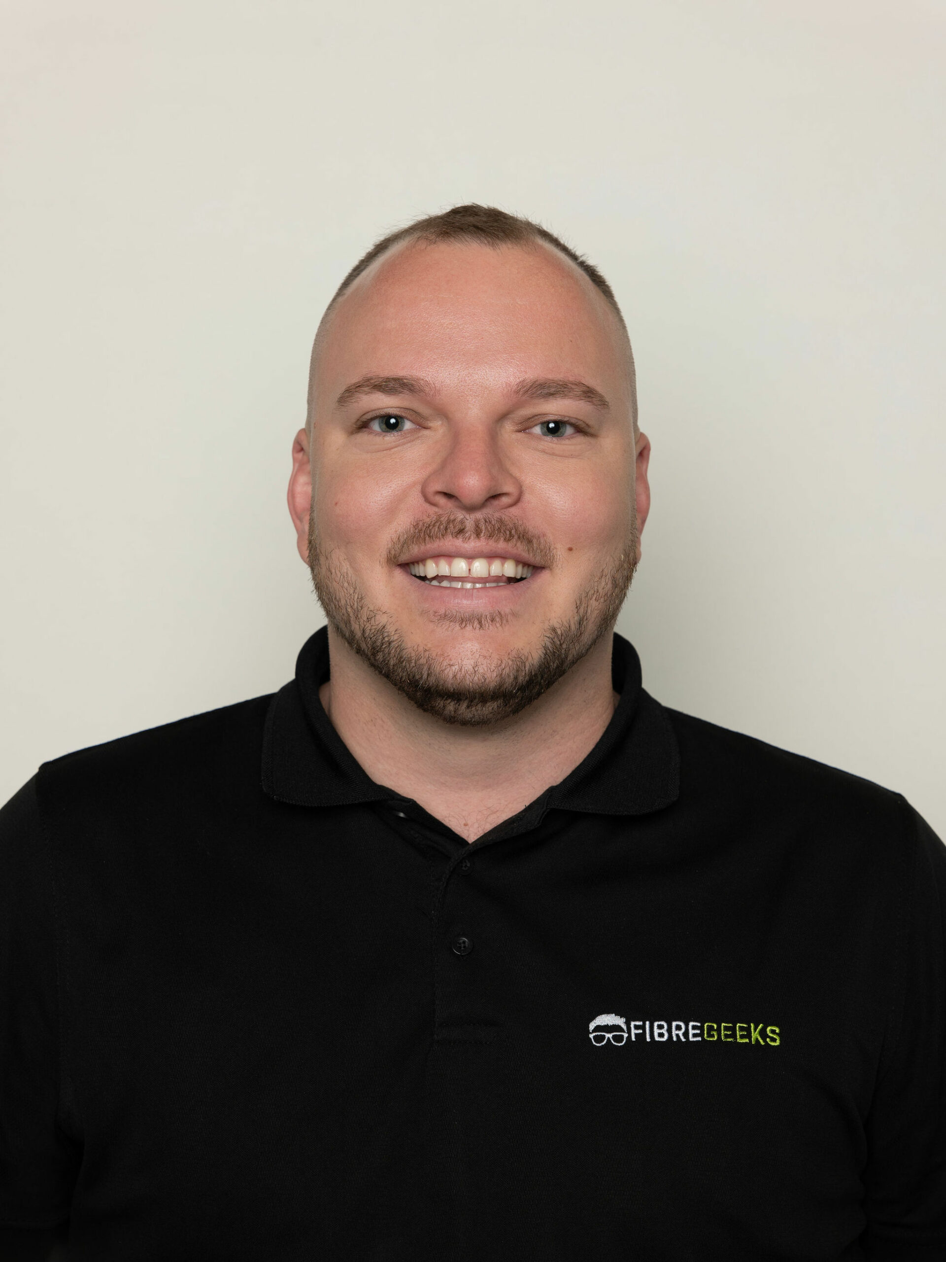 a man smiling for a picture