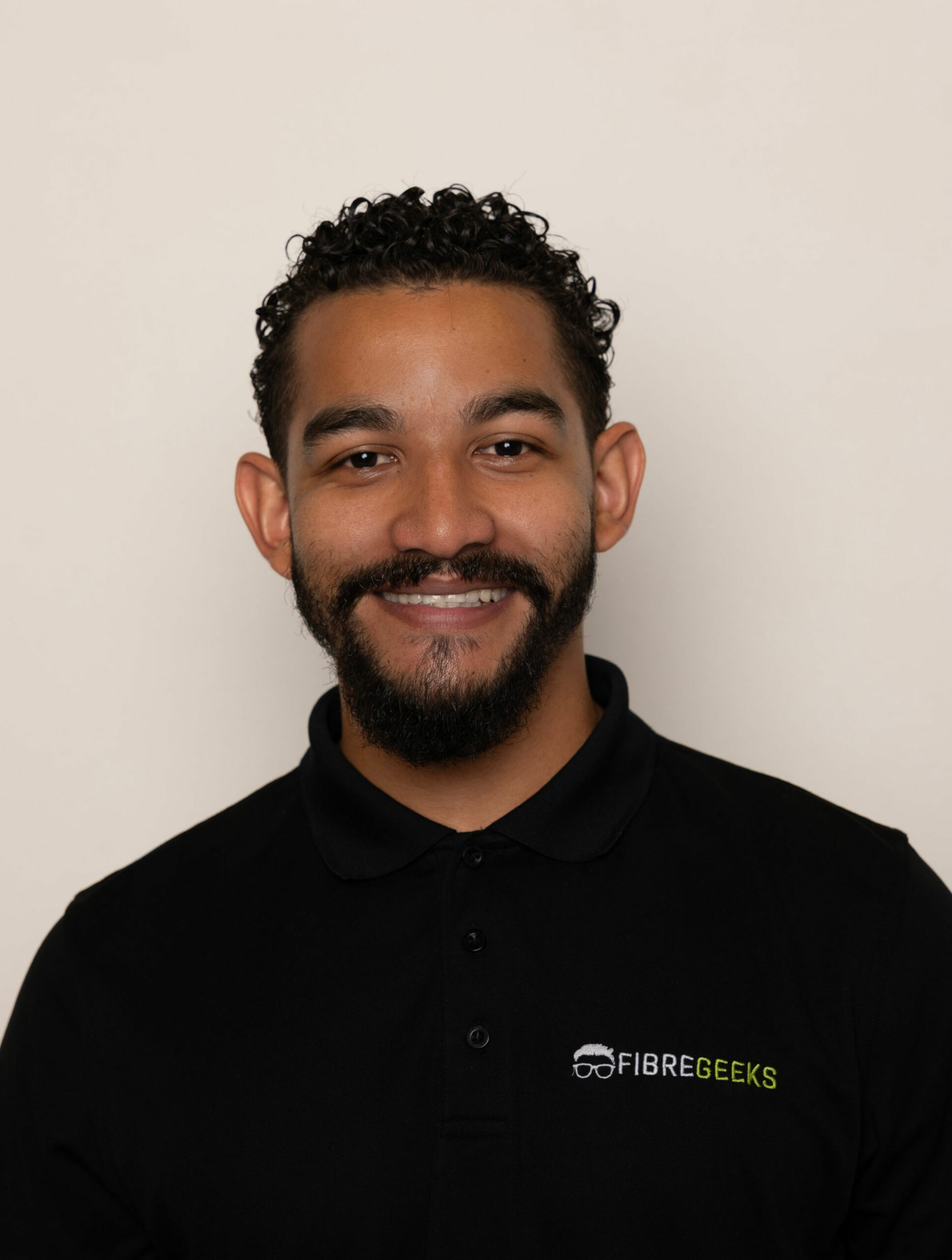 a man with a beard and mustache wearing a black shirt