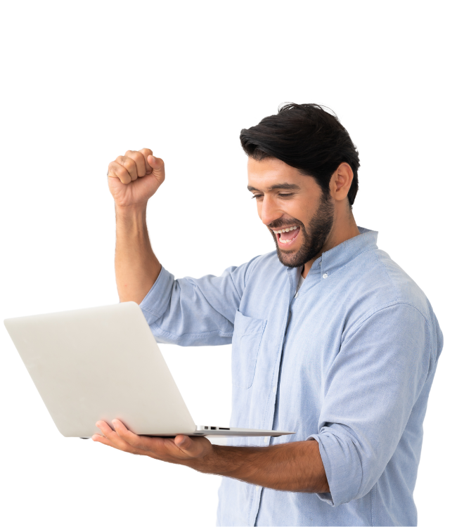 a man holding a laptop and raising his fist