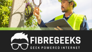 a man in a safety vest holding a tablet
