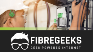 a man in a hard hat holding a green cable
